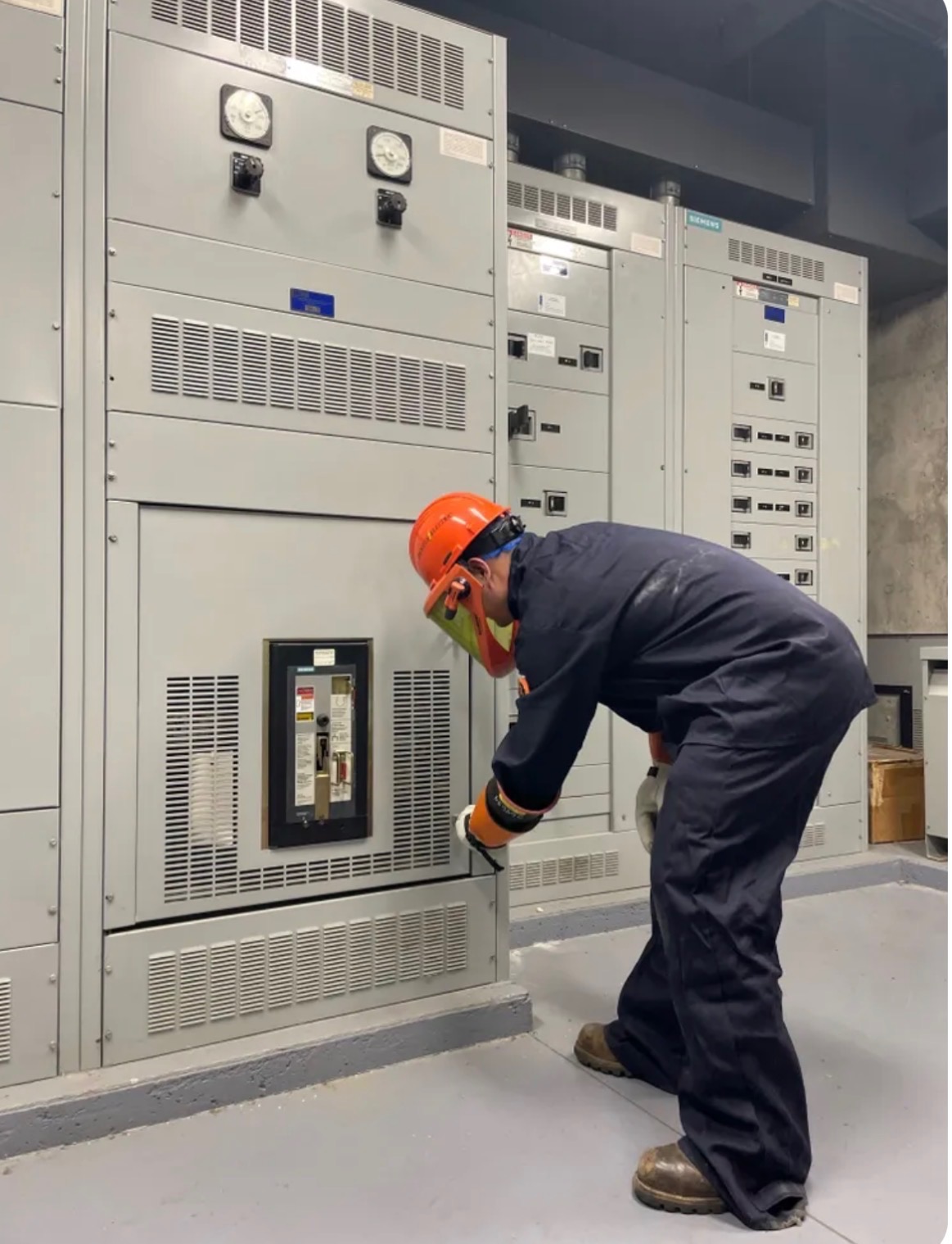 Close-up industrial control panel with electrical indicators and controls